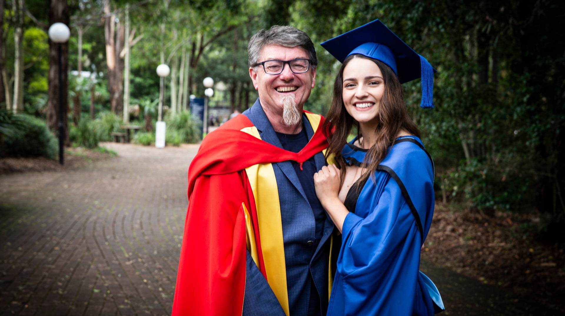 Biomedical engineering graduate Eileen Wallace with her father Professor Gordon Wallace in her graduation gown at UOW