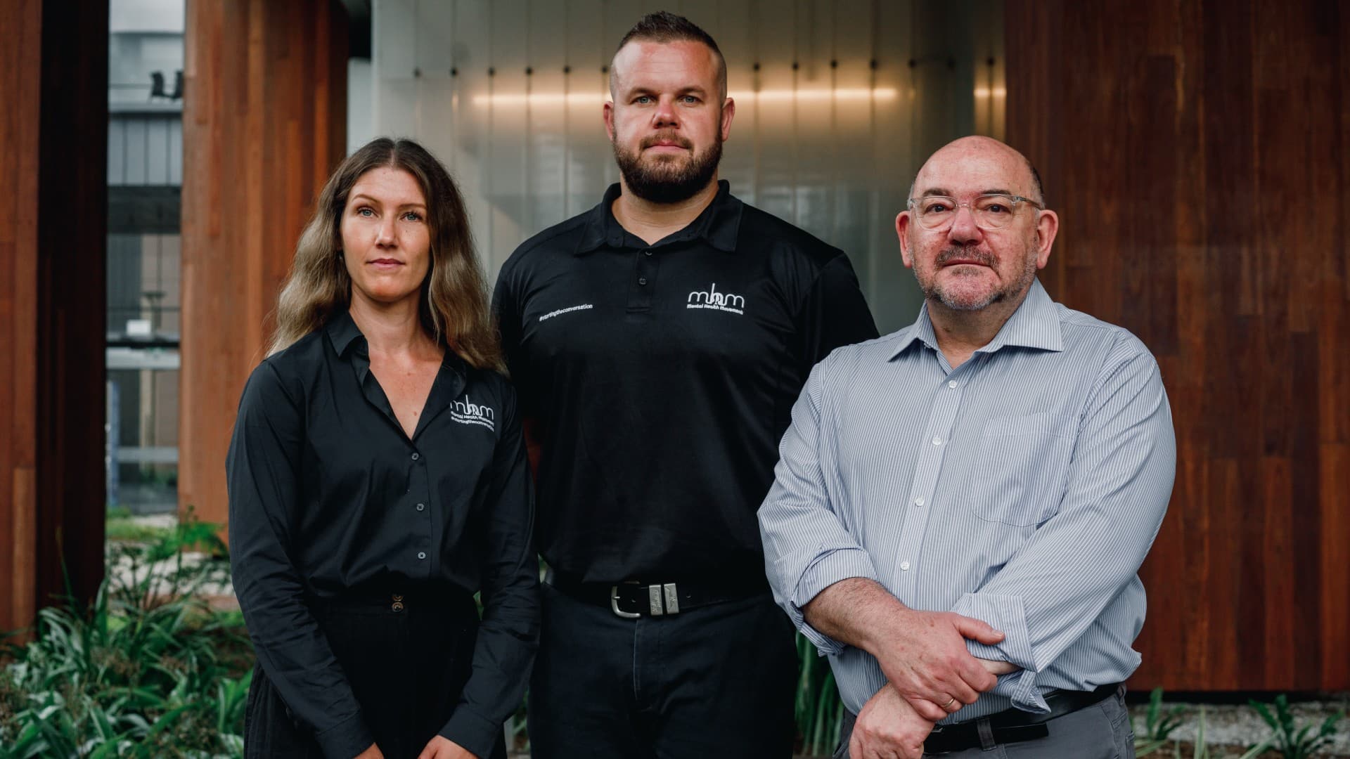 Dr Alisha McGregor, Dan Hunt, and Professor Peter Caputi stand in front of a building on UOW
