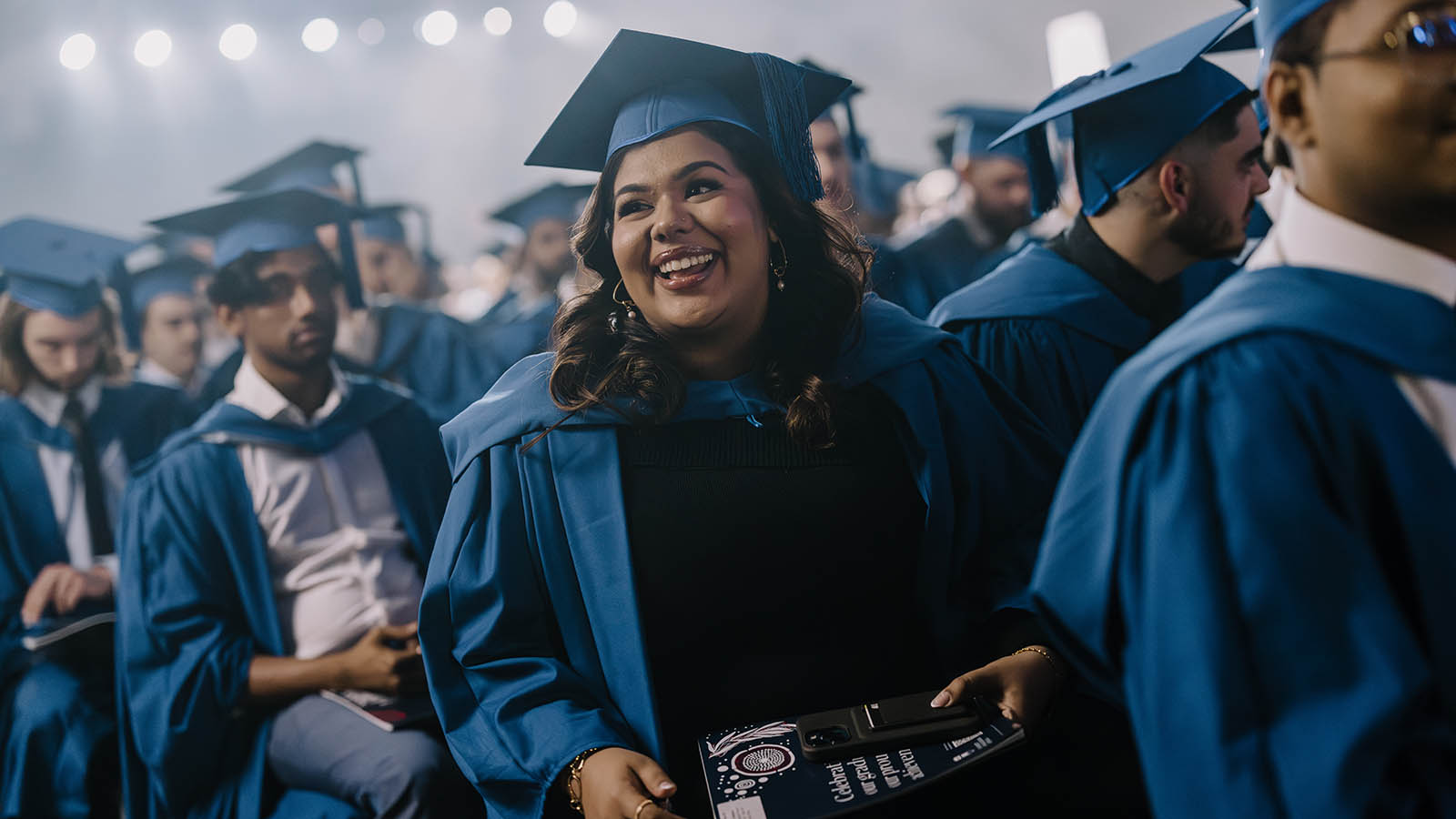 A female UOW student smiles during her graduation ceremony