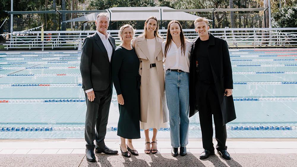 Olympic swimmer Emma McKeon with her family poolside at the ceremony to rename the UOW UniActive pool in her honour.