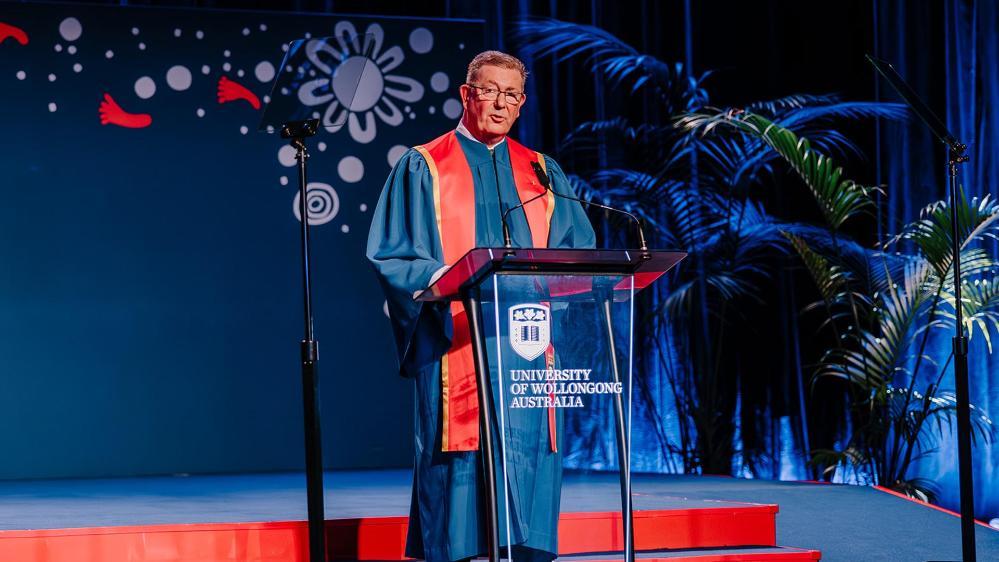 Graham Lancaster addresses graduating students from the Faculty of Business and Law after receiving his honorary doctorate.