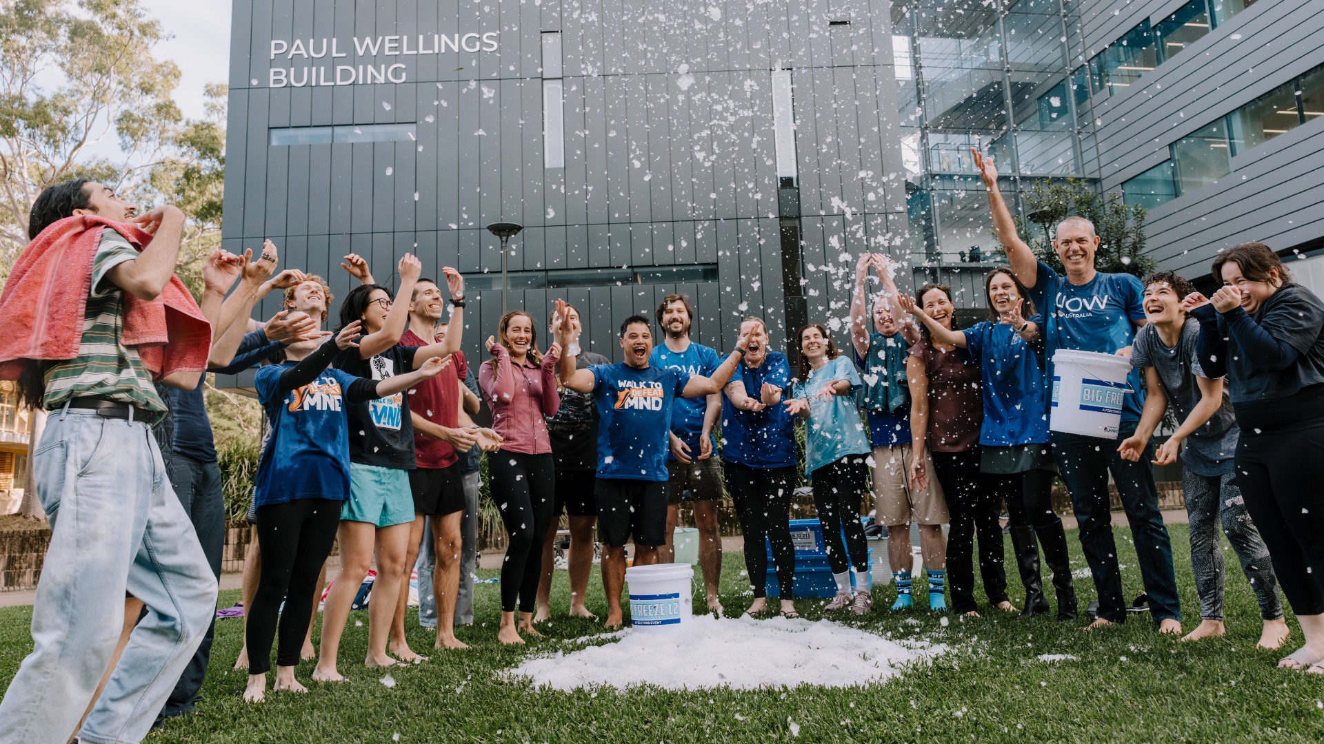 A group of people throwing ice into the air