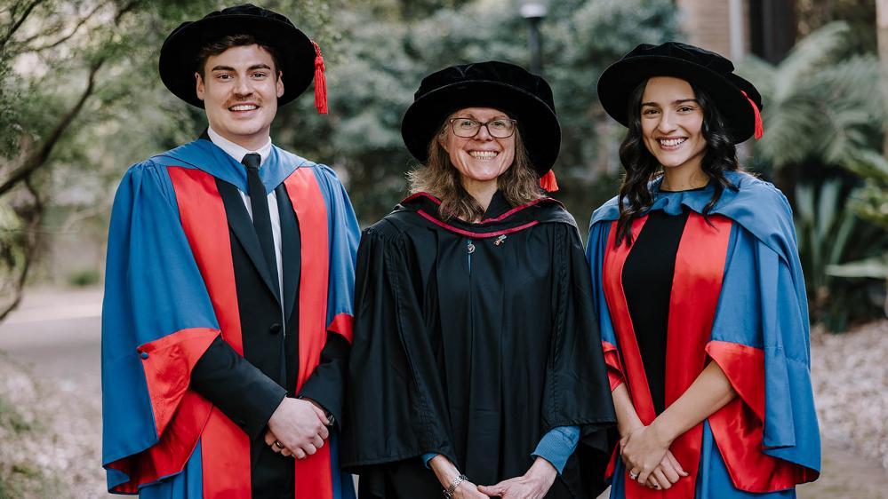 IPRI PhD graduates Mitchell St Clair-Glover and Eileen Stacey with Professor Mirella Dottori.