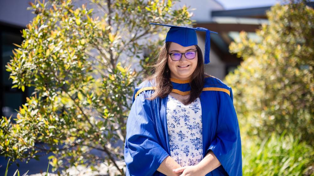 Master of Teaching graduate Jess Campbell smiles during the UOW Eurobodalla graduation ceremony. January 2025