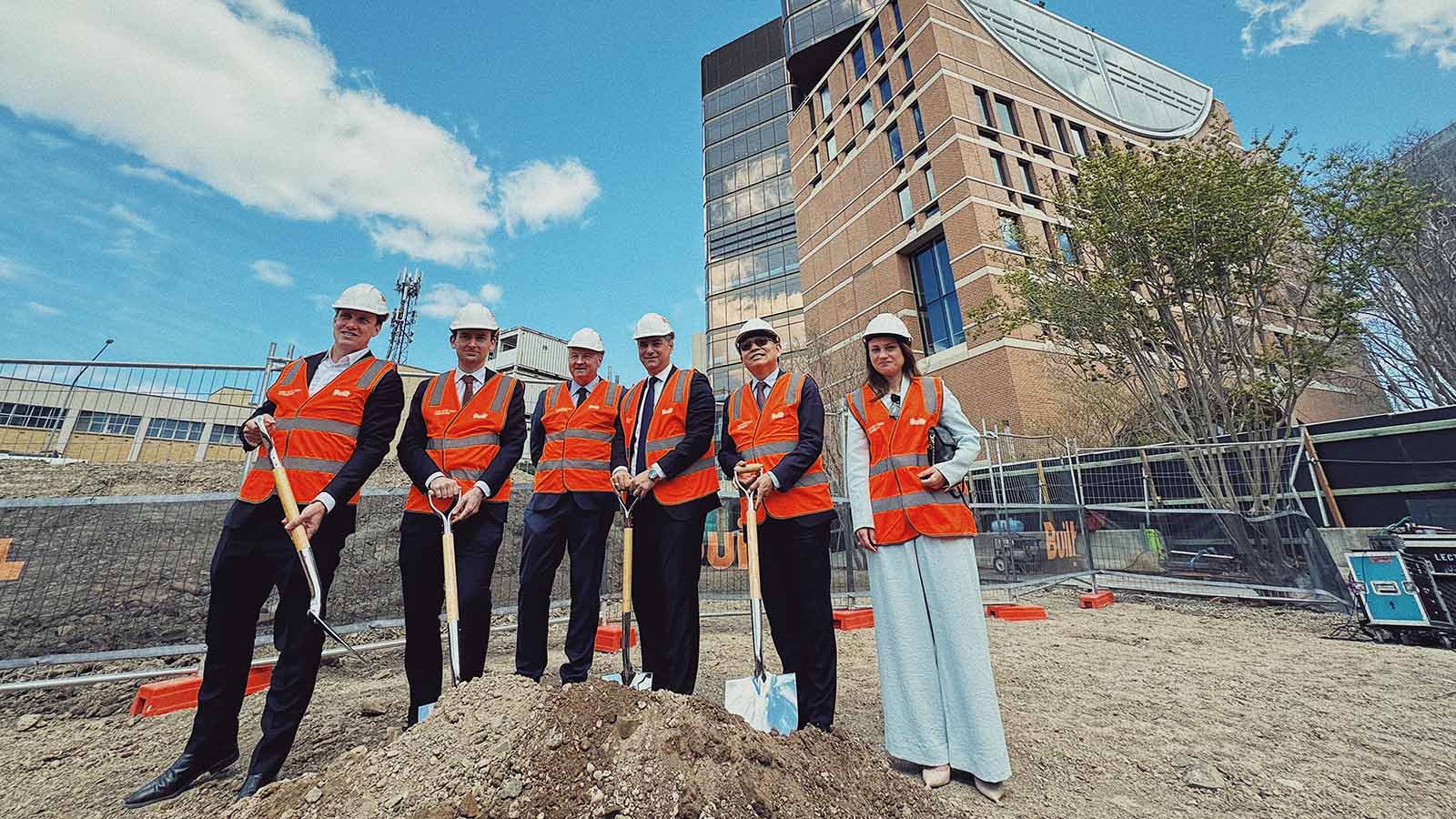 UOW Vice-Chancellor and President Professor G.Q. Max Lu with Built Development Director Jono Cottee, Liverpool City Council Mayor Ned Mannoun and others at the sod-turning ceremony to mark the start of the next stage of construction at the landmark Liverpool Civic Place development.