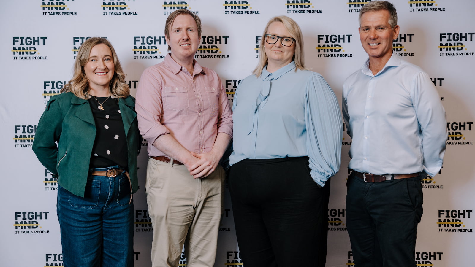 Dr Bec Sheean, Dr Luke McAlary, Dr Dezerae Coz and Matt Tilley stand in front of a Fight MND media wall. Photo: Michael Gray