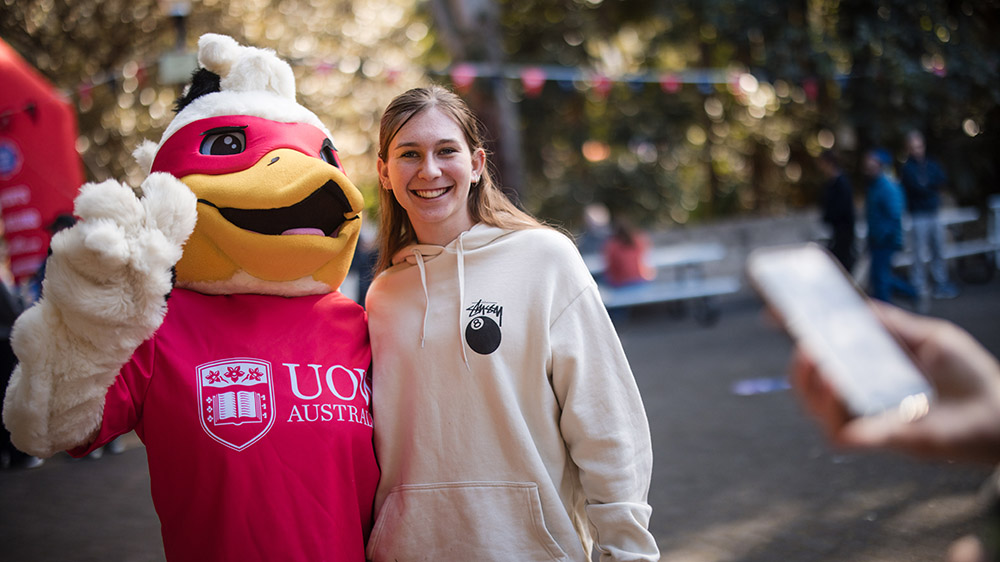 Baxter the duck with a student at UOW Open Day 2025