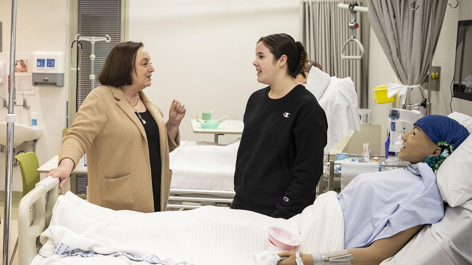 UOW Vice-Chancellor Professor Patricia Davidson talks to nursing student Emily Heyho at UOW Sutherland.