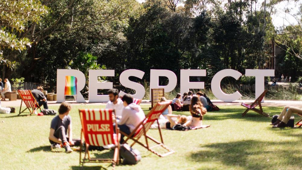 RESPECT letters setup on the lawn at UOW Wollongong for O week with deck chairs in the foreground.