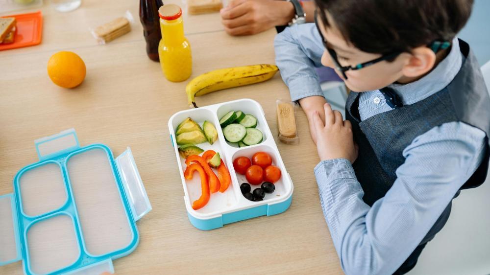 A lunch box with fruit and vegetables