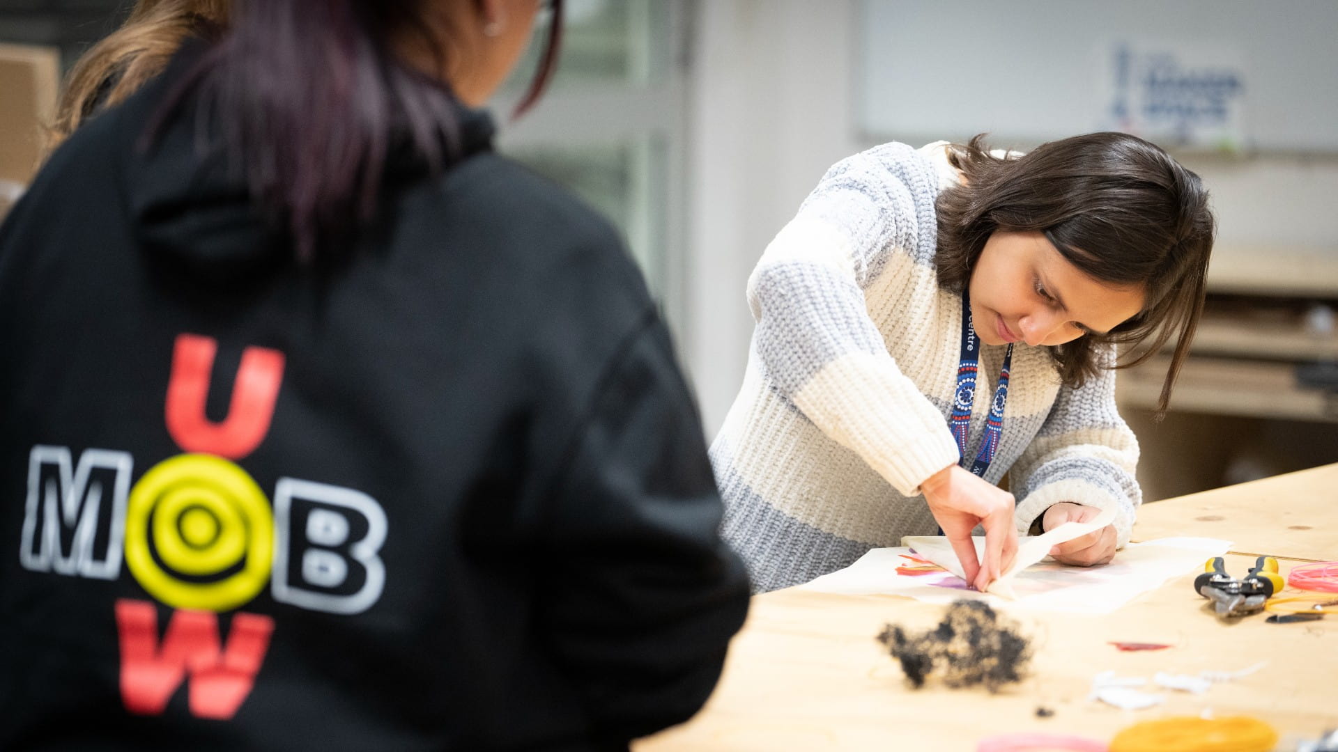 A student from Woolyungah Summer Camp examines her creation at ýapp Makerspace while another student looks on. Photo: Paul Jones