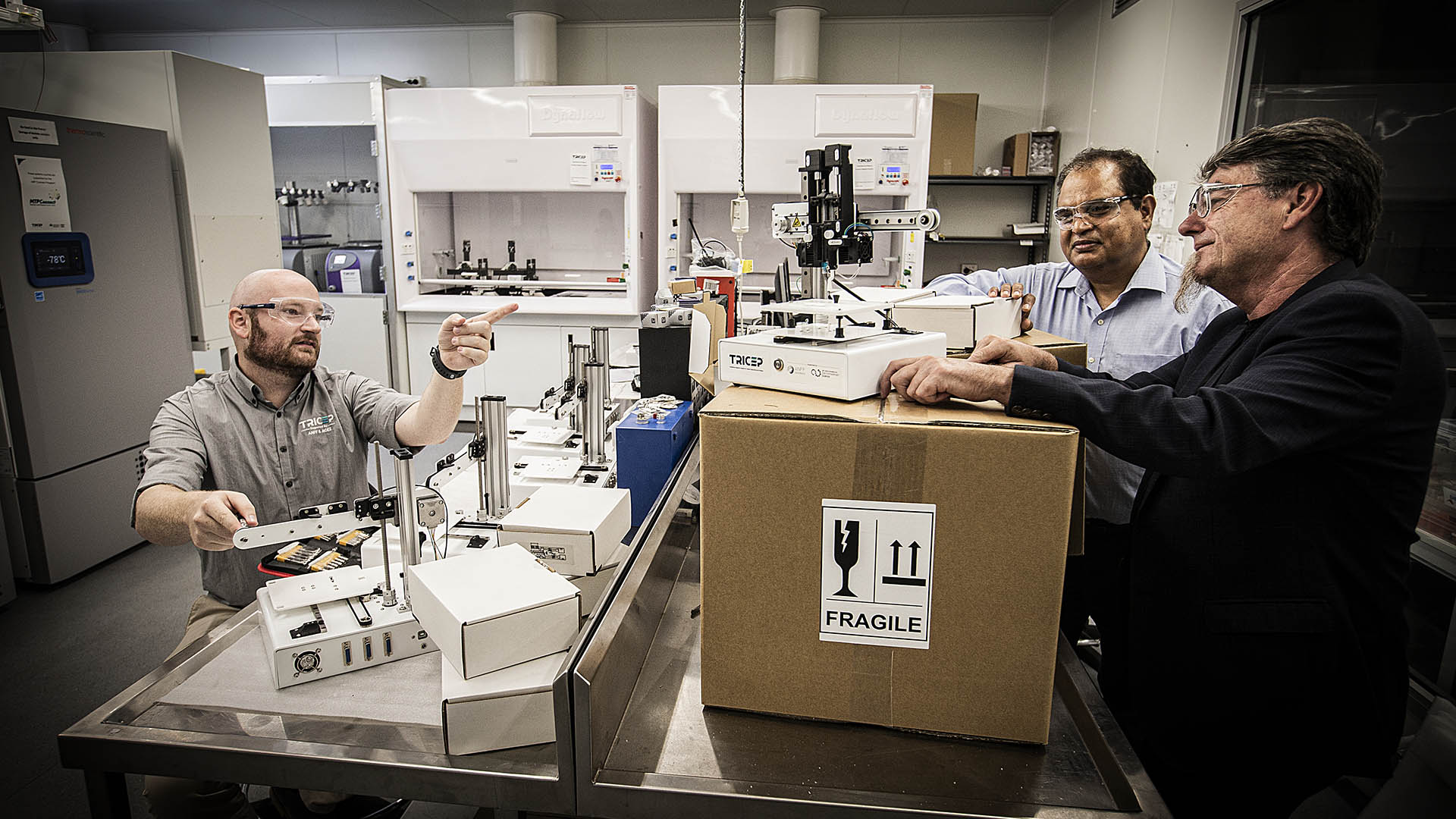 Cameron Angus, Dr Sanjeev Gambhir, and Professor Gordon Wallace with a 3D Genii bioprinter at UOW's Translational Research Initiative for Cellular Engineering and Printing (TRICEP) facility.