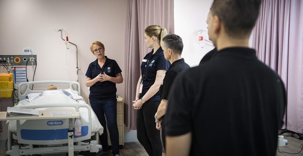 BAMS employees take part in infection control training at UOW's South Western Sydney Campus. Photo: Paul Jones