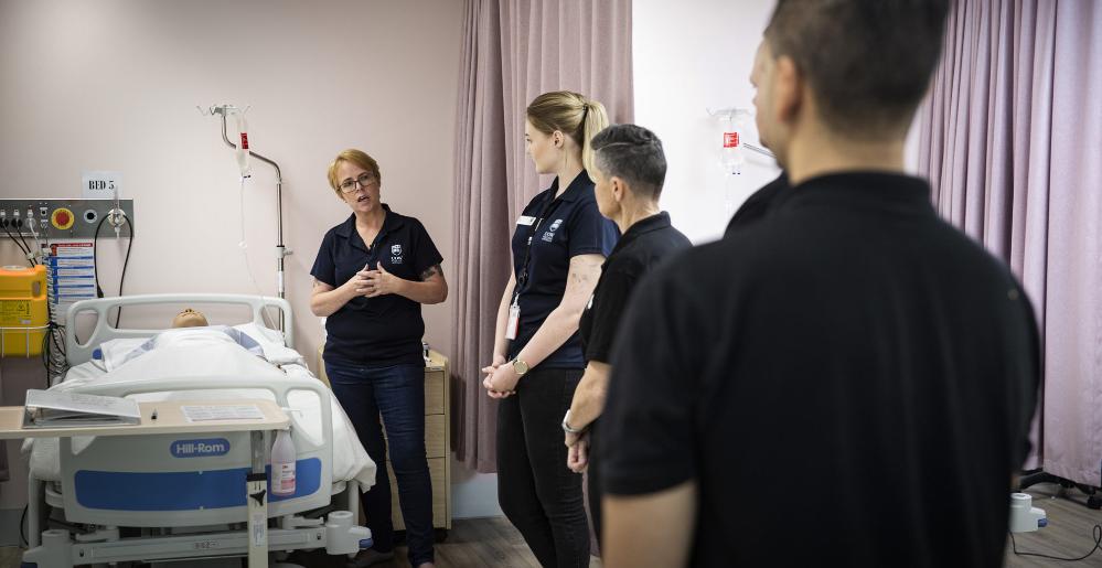 BAMS employees take part in infection control training at UOW's South Western Sydney Campus. Photo: Paul Jones