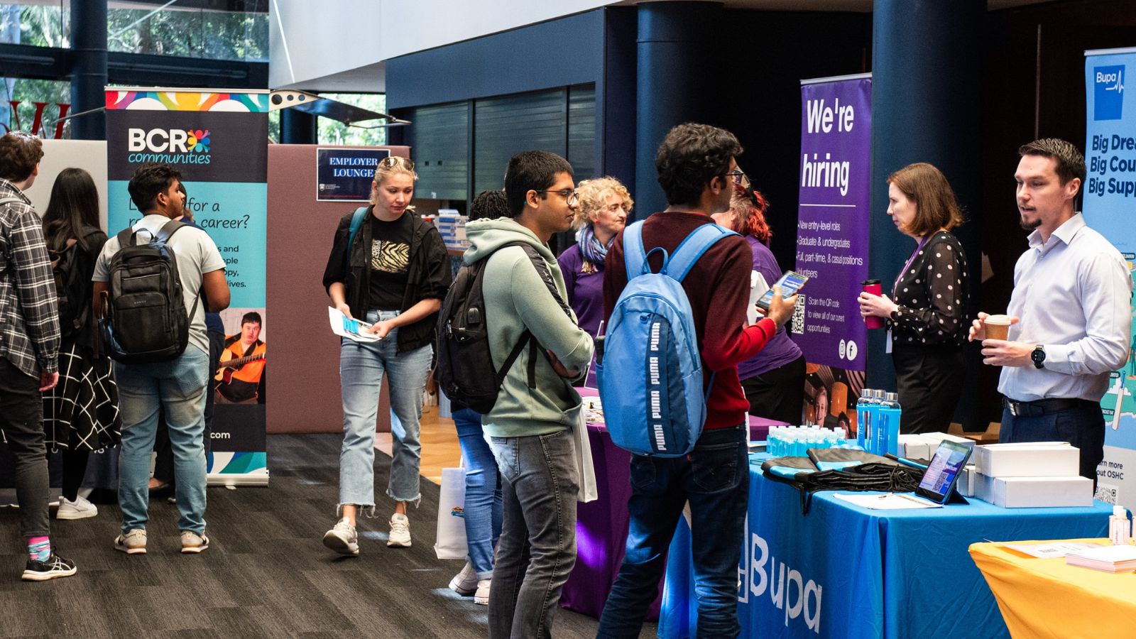 Students talk with exhibitors at the UOW STEM and Health Careers Expo.