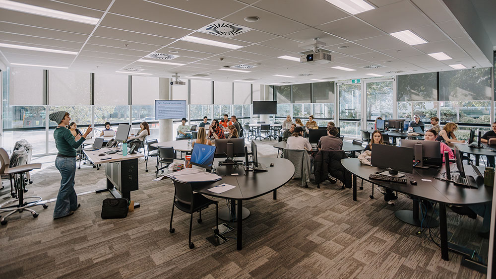 Undergraduate students in a classroom in the Jillian Broadbent Building.