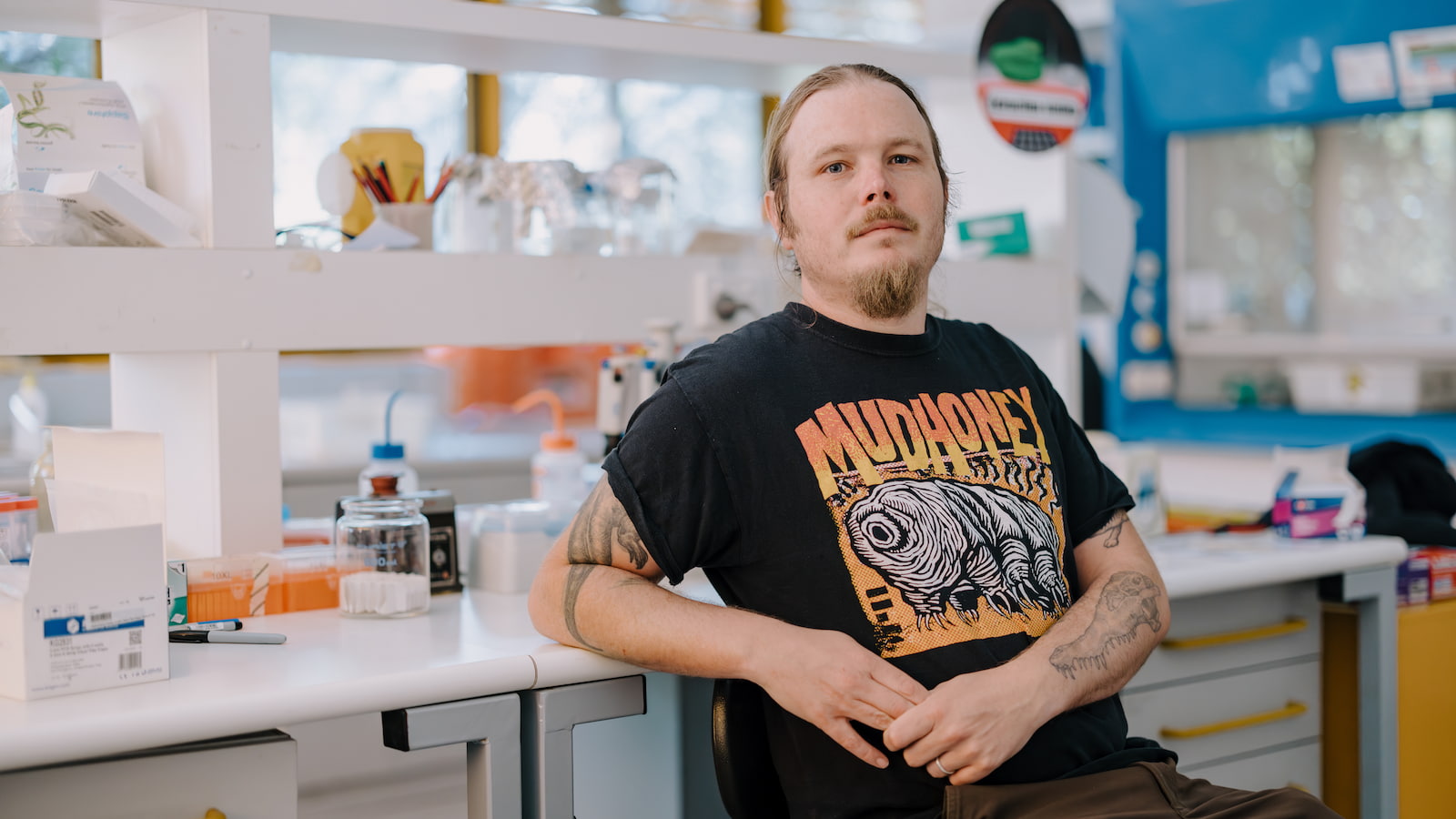 Researcher Damien Esquerre sits at a bench in a science laboratory. Photo: Michael Gray