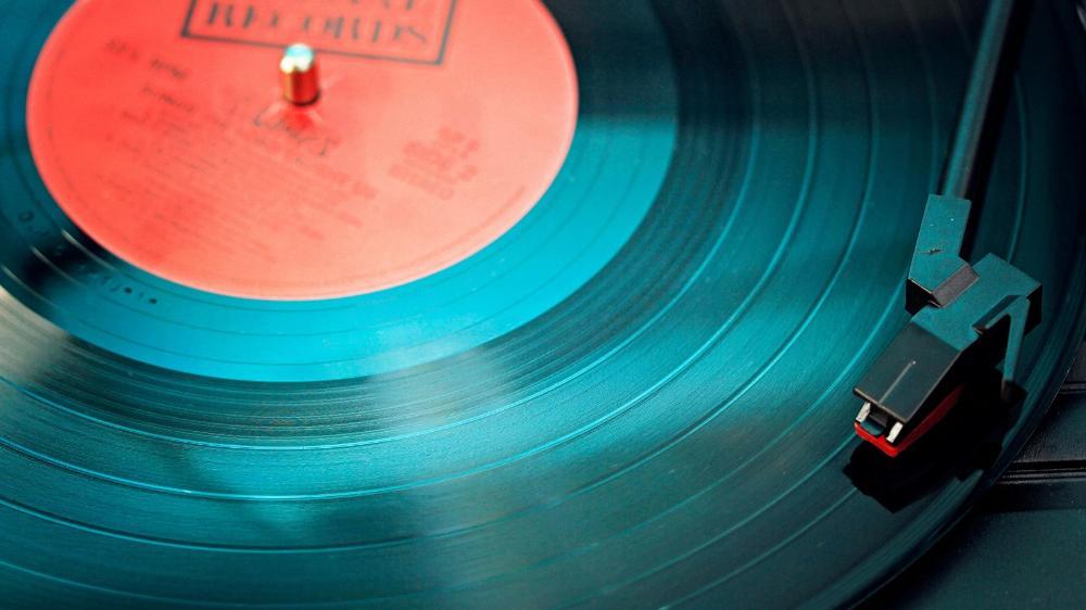 A vinyl record with a red label