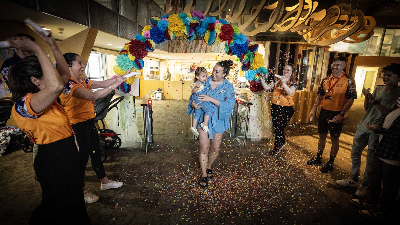Addison and Rachel Micallef are welcomed to Early Start Discovery Space with confetti to celebrate Addison being the one-millionth visitor to the Discovery Space.