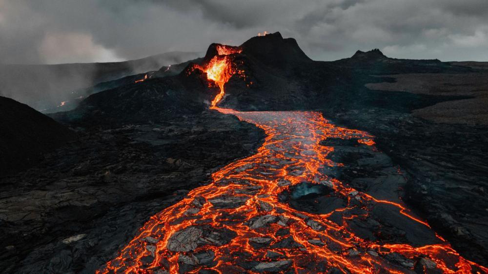 Glowing lava seeps from a volcano