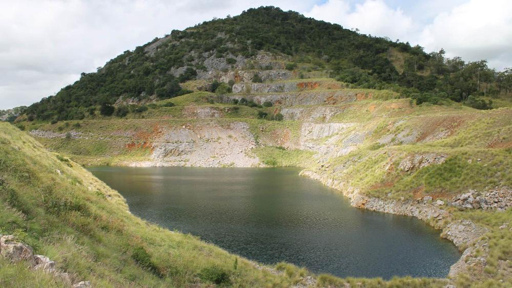 A mountain with a lake in front of it. Photo: Scott Hocknull