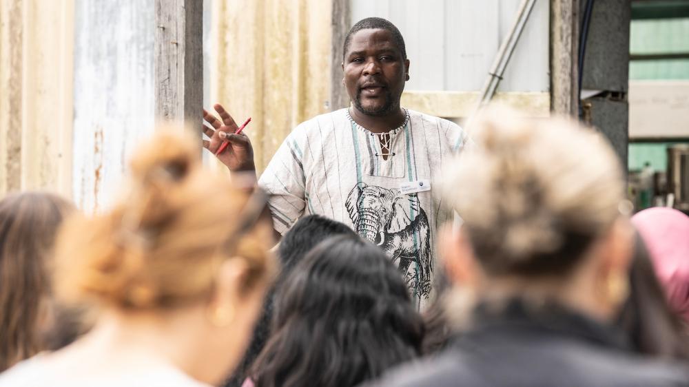Rugare Mugumbate speaks to the audience of social workers at Dapto Community Farm. Photo: Paul Jones