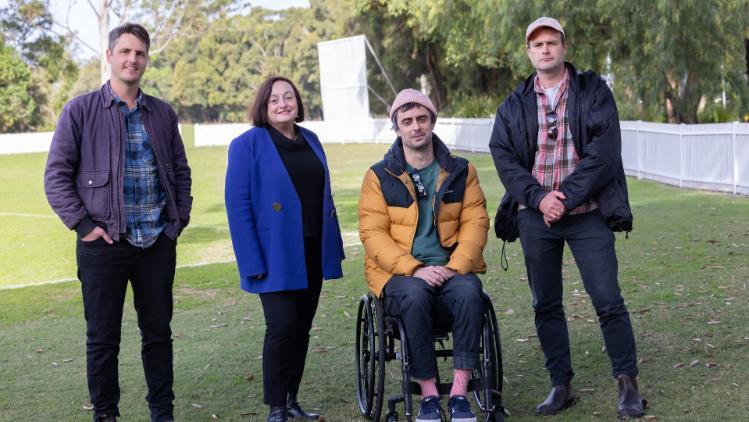 Professor Patricia Davidson, second from left, with the team from Yours and Owls, Adam Smith, Ben Tillman and Balunn Jones. They are standing at an Oval at UOW. Photo: Mark Newsham.