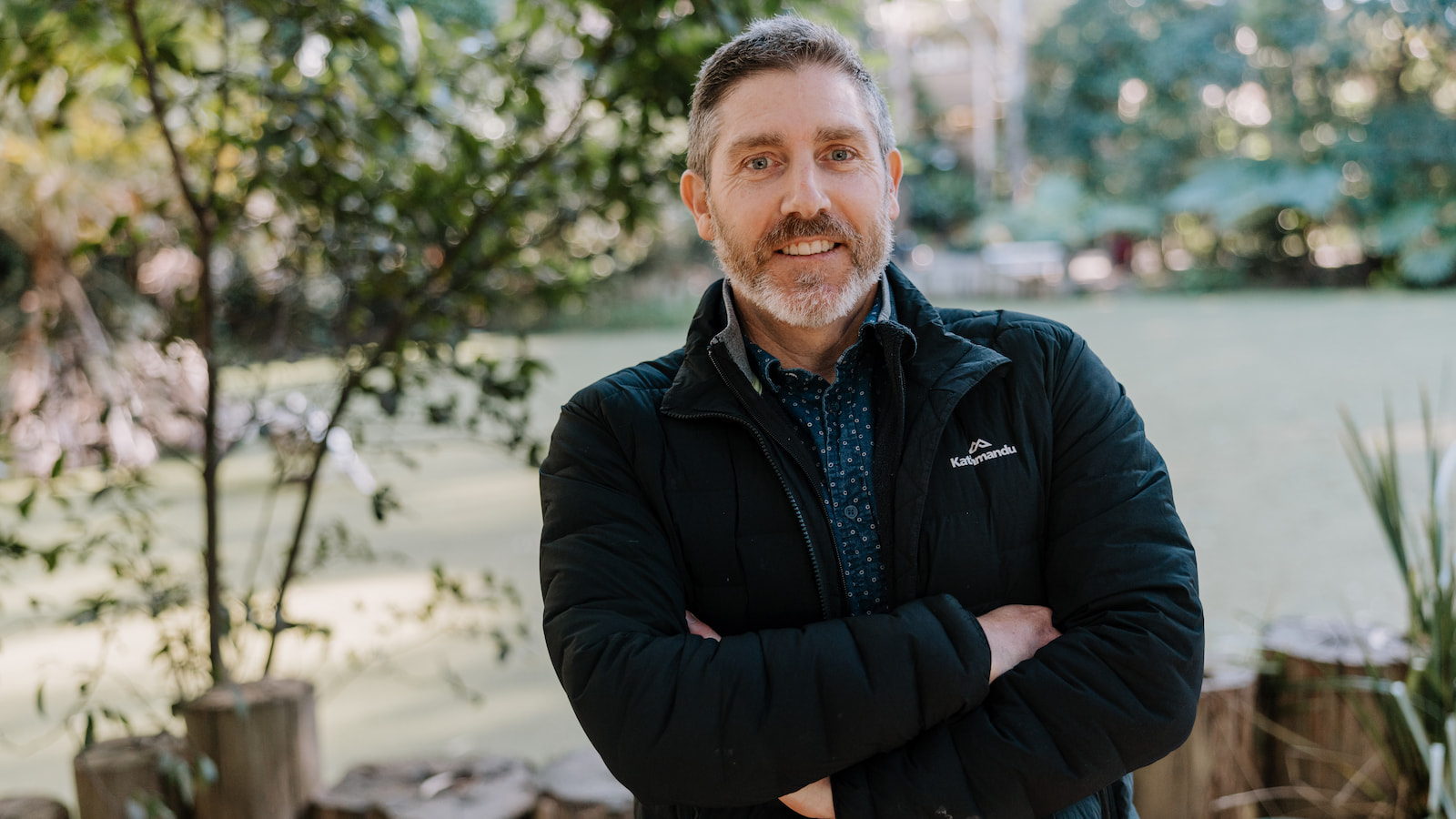 Professor Phillip Byrne stands in front of a group of trees on UOW's Wollongong Campus. Photo: Michael Gray