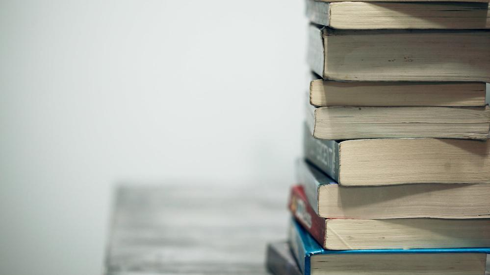 A generic stack of books on a desk