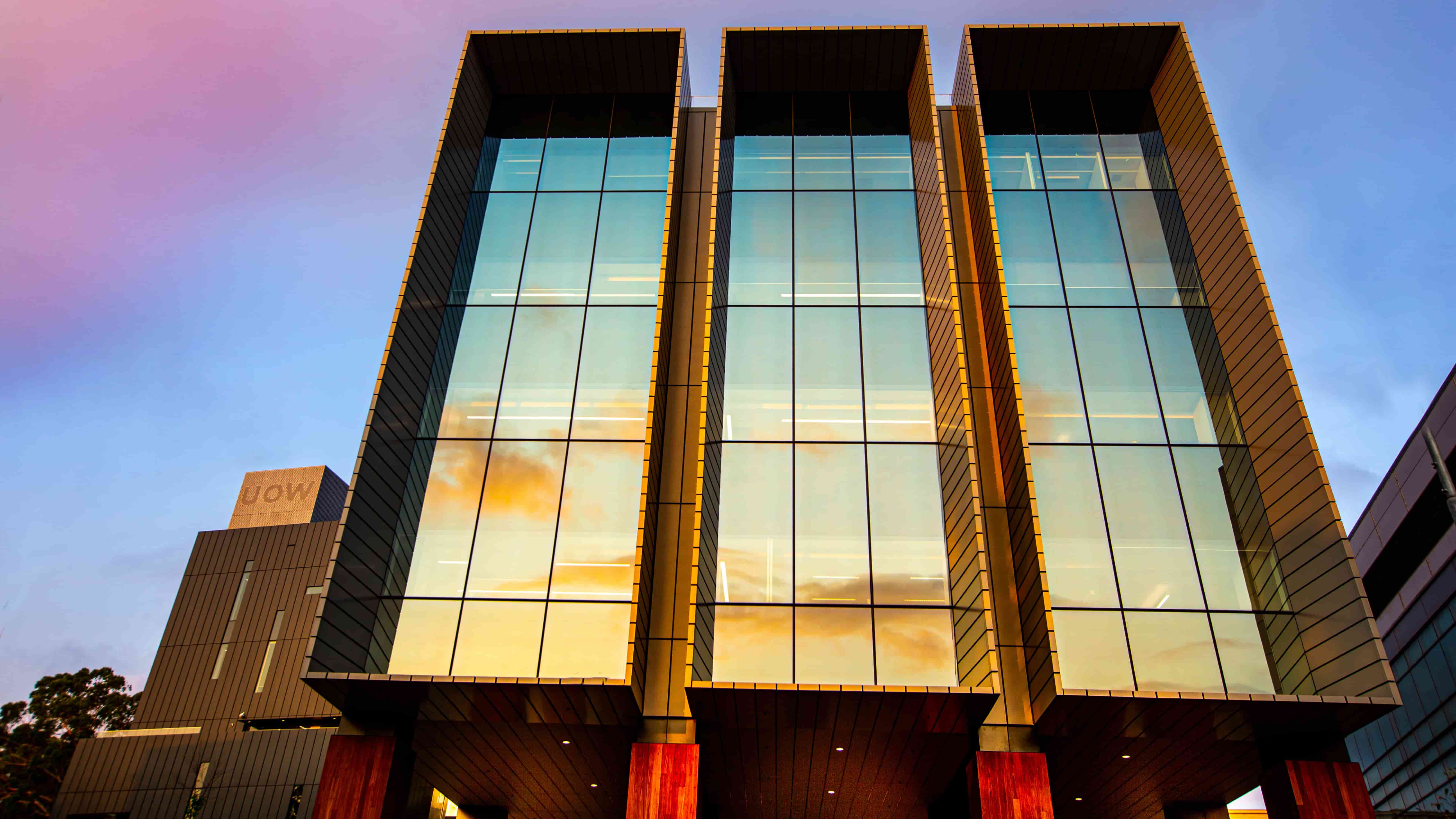 An external shot of UOW's Molecular Horizons Building with a sunset in the background. Photo: Paul Jones