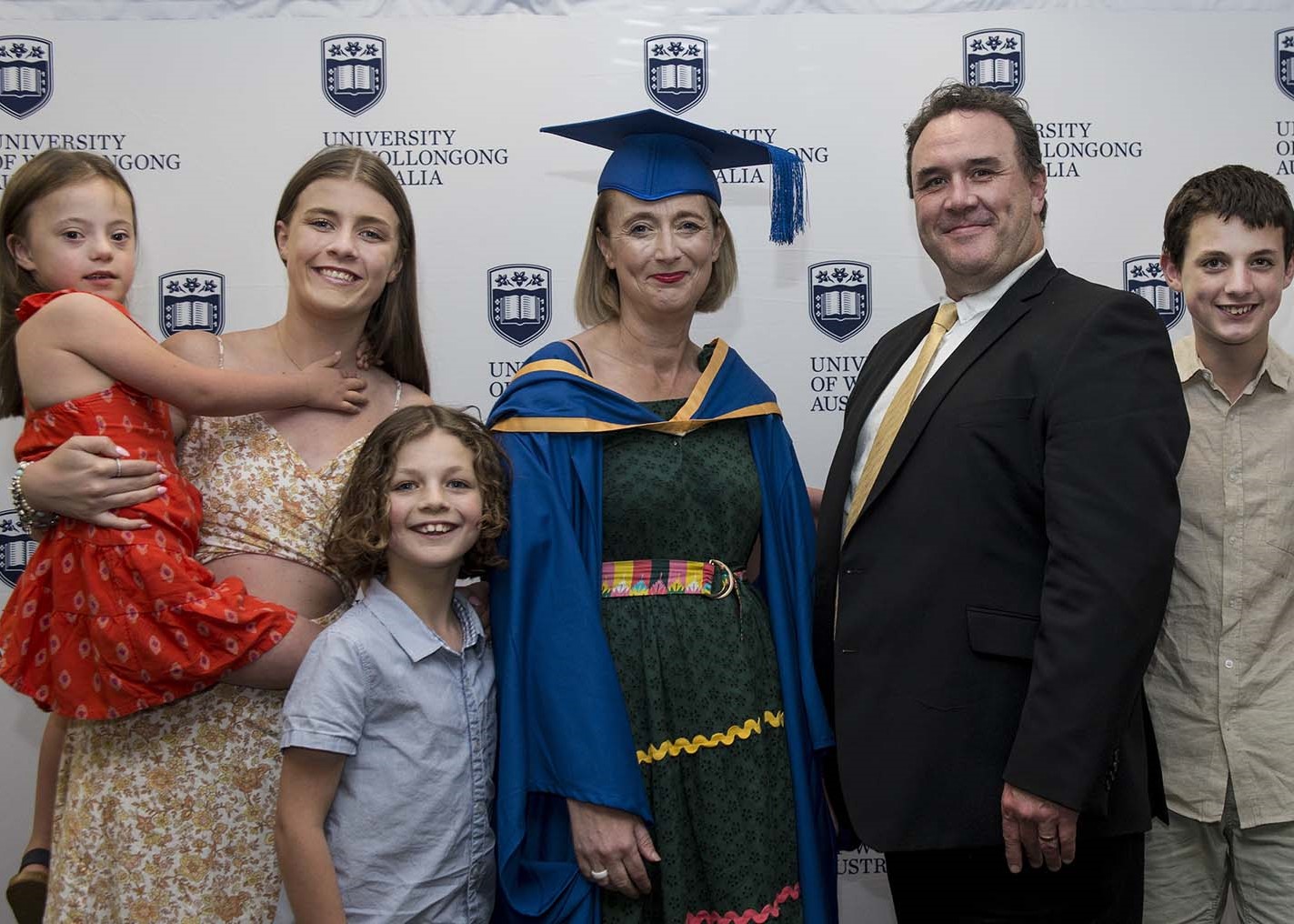 Deborah Combes celebrating with family on at her graduation ceremony after completing a Master of Teaching degree at UOW Shoalhaven.