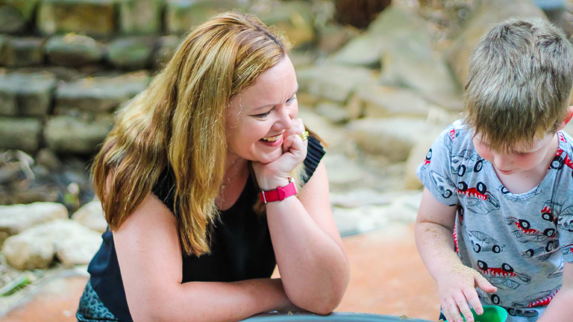 Lisa Kervin playing with a child in the sandpit