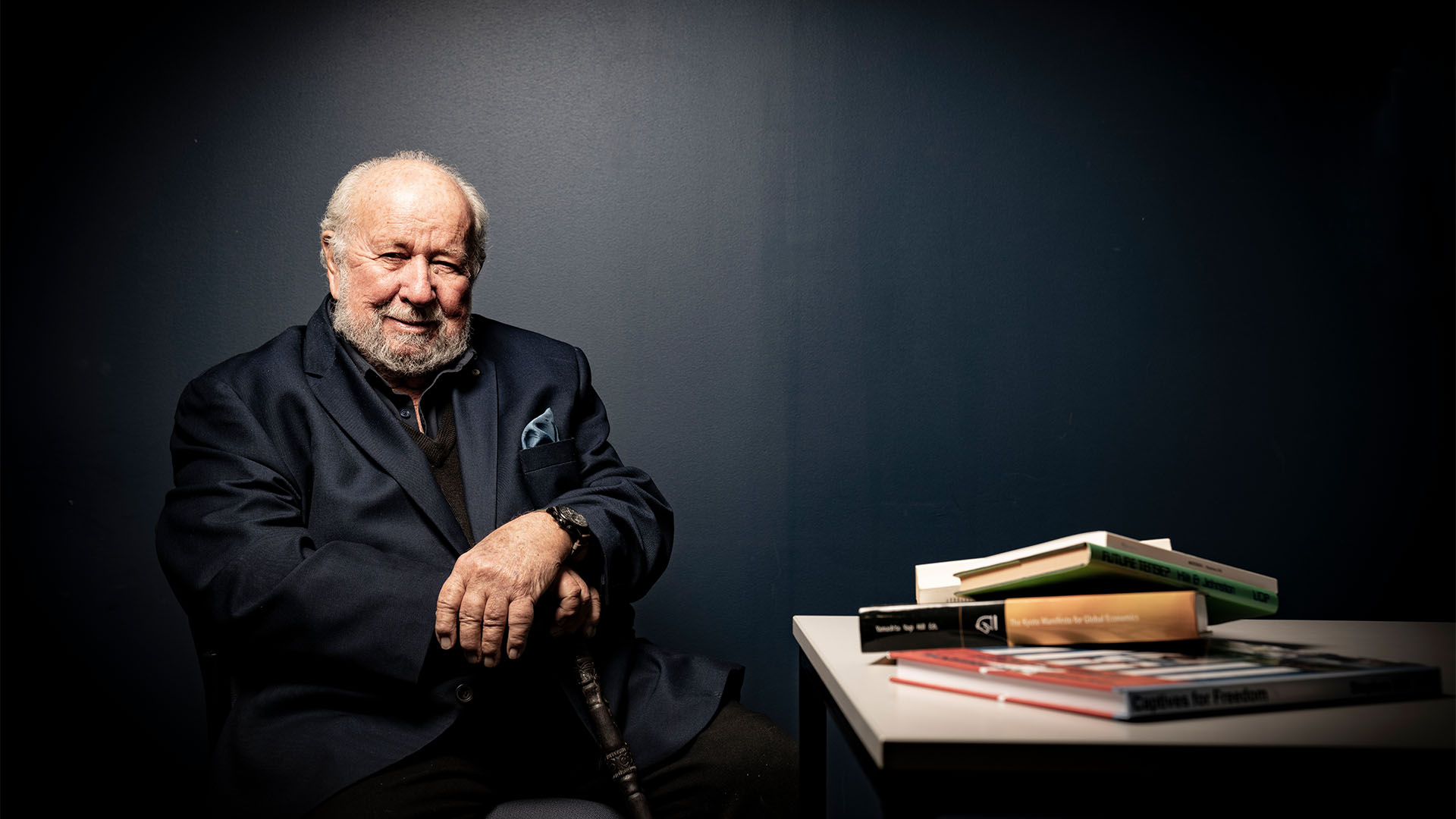 Professor Stephen Hill at the desk with books