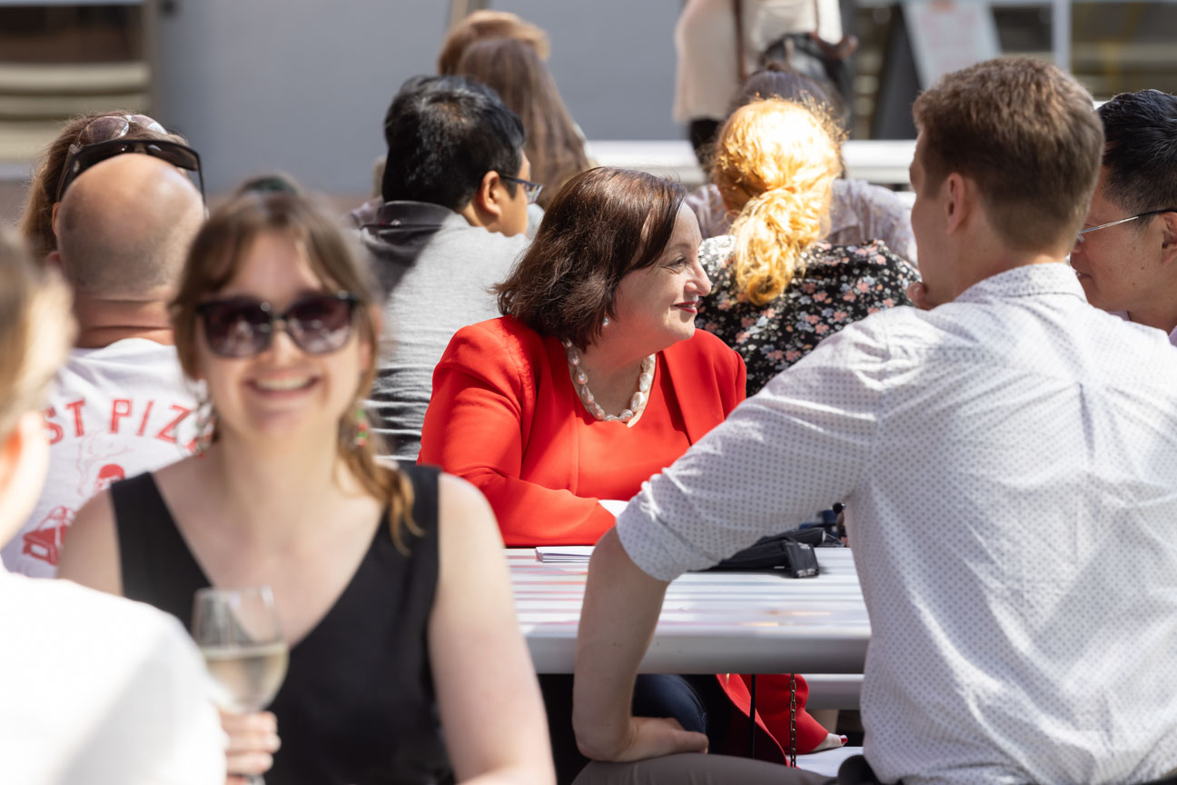 VC chatting with people at UniBar