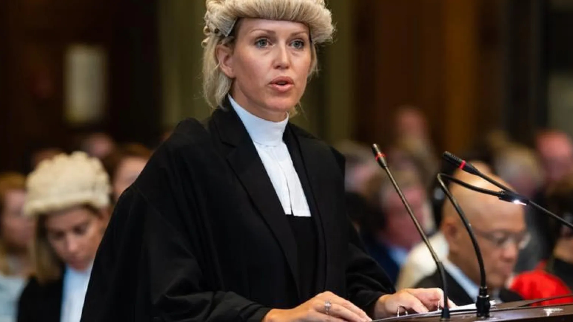 Jennifer Robinson in her lawyers gown and wig in action at trial