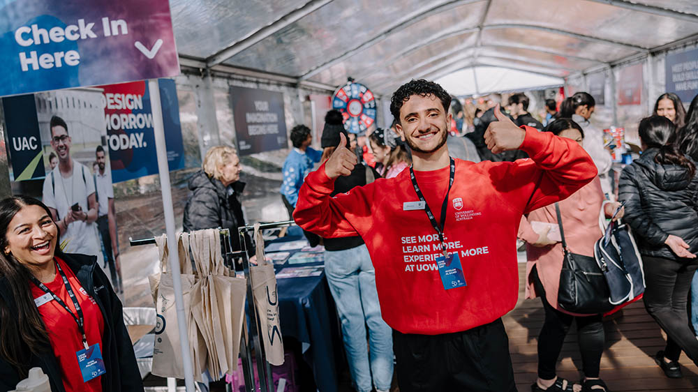 A UOW student adviser gives the thumbs up at the UOW Liverpool 2025 Open Day at Civic Place Liverpool