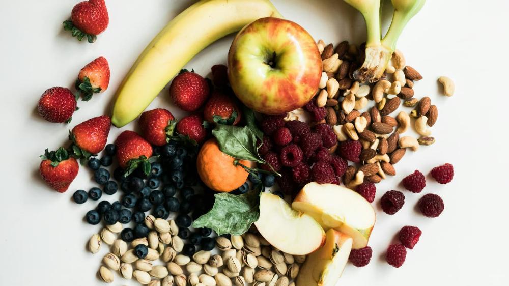 A close up of a spread of fruits, vegetables and nuts. Photo: Unsplash