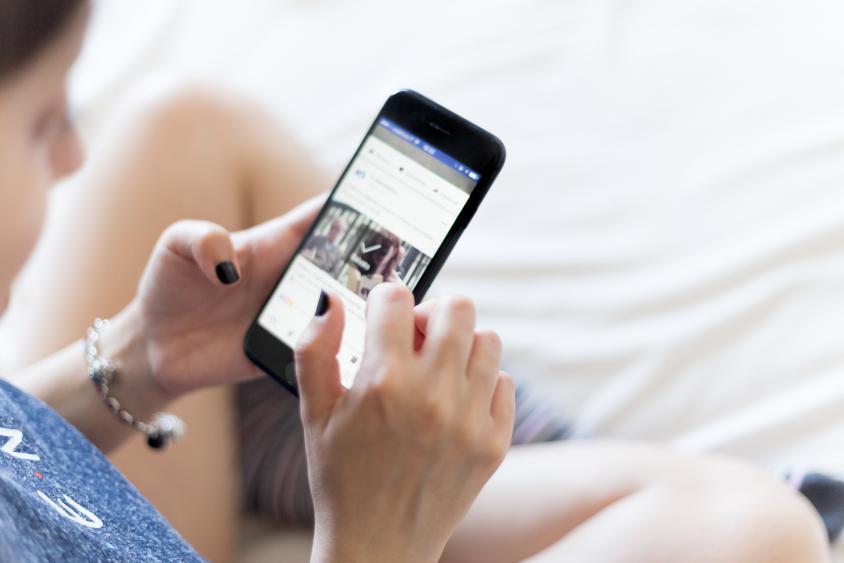 Woman holding mobile phone