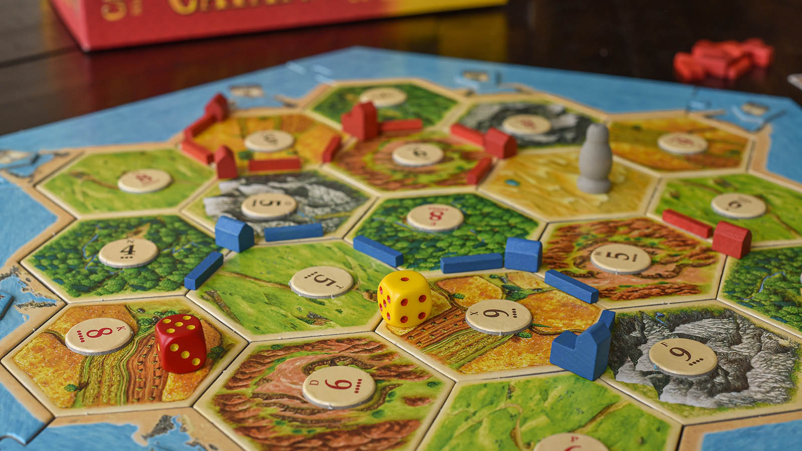 A Settlers of Catan game with pieces spread across the board.